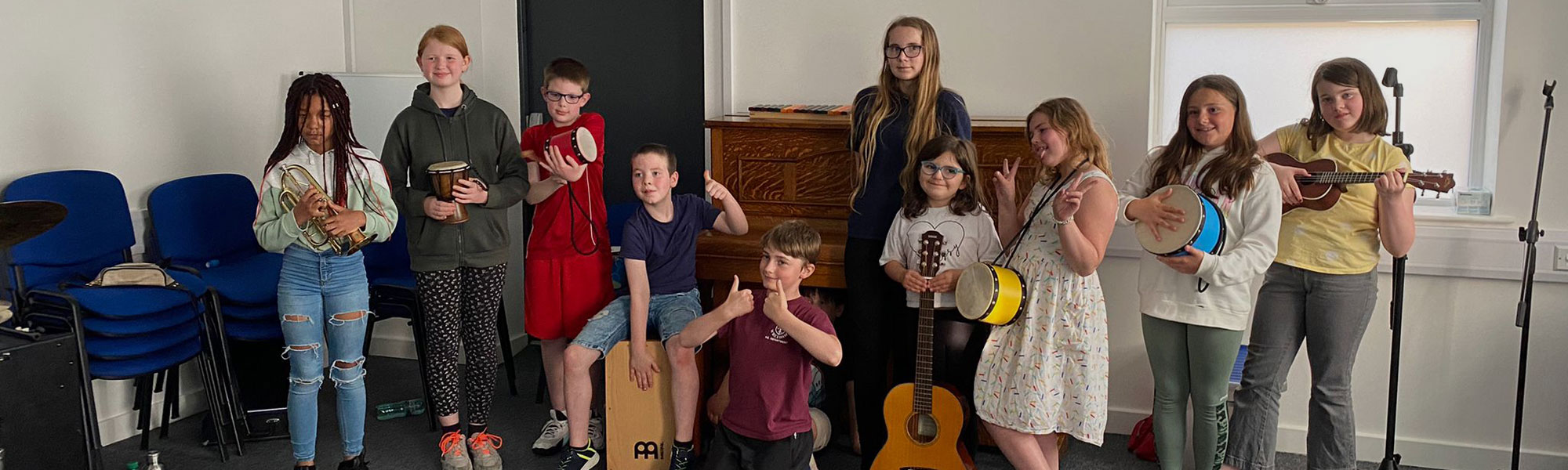Group of children with musical instruments at Wrexham Sounds